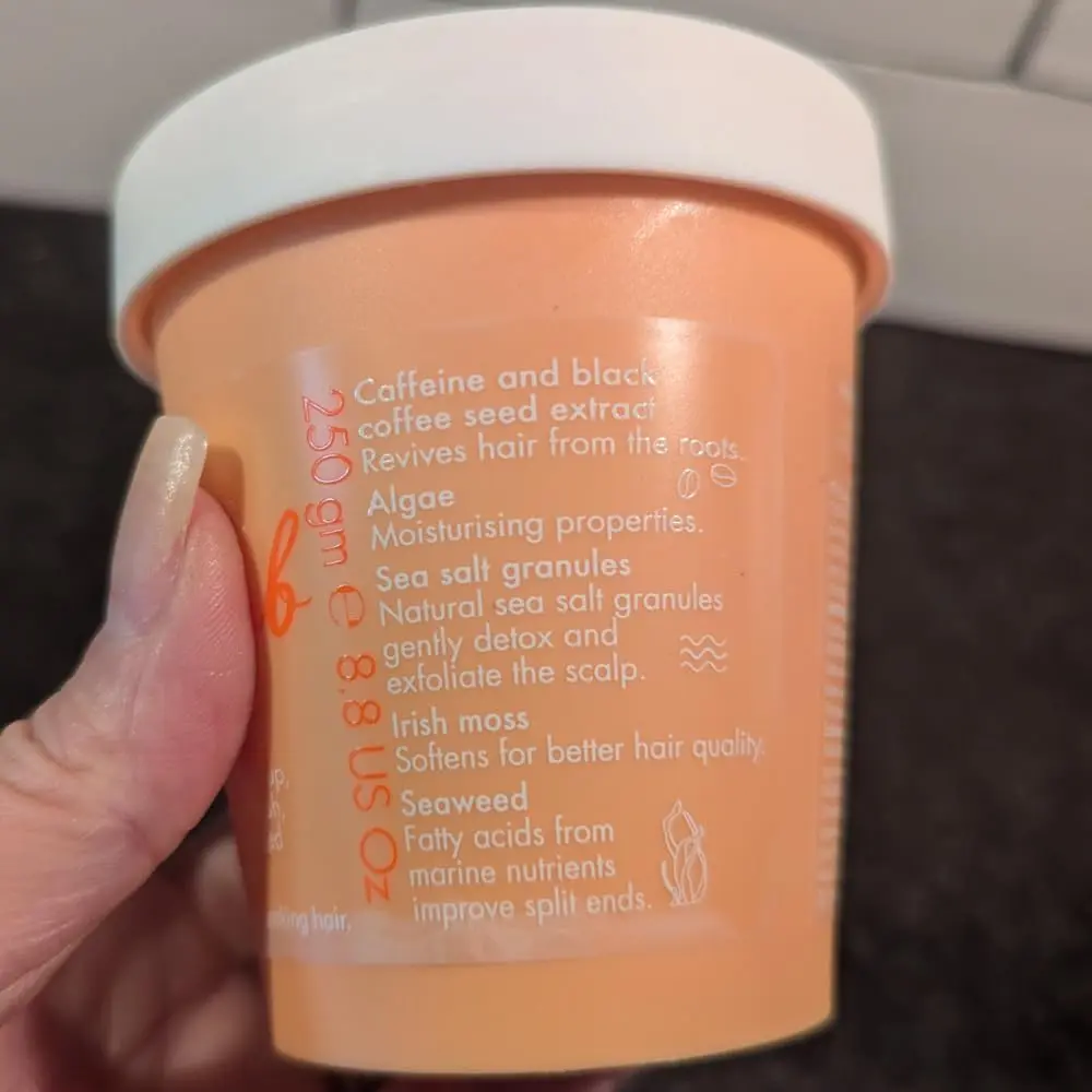 Umberto Giannini Grow Scrub gently exfoliates the scalp, removing buildup and promoting hair growth with its vegan and cruelty-free formula.