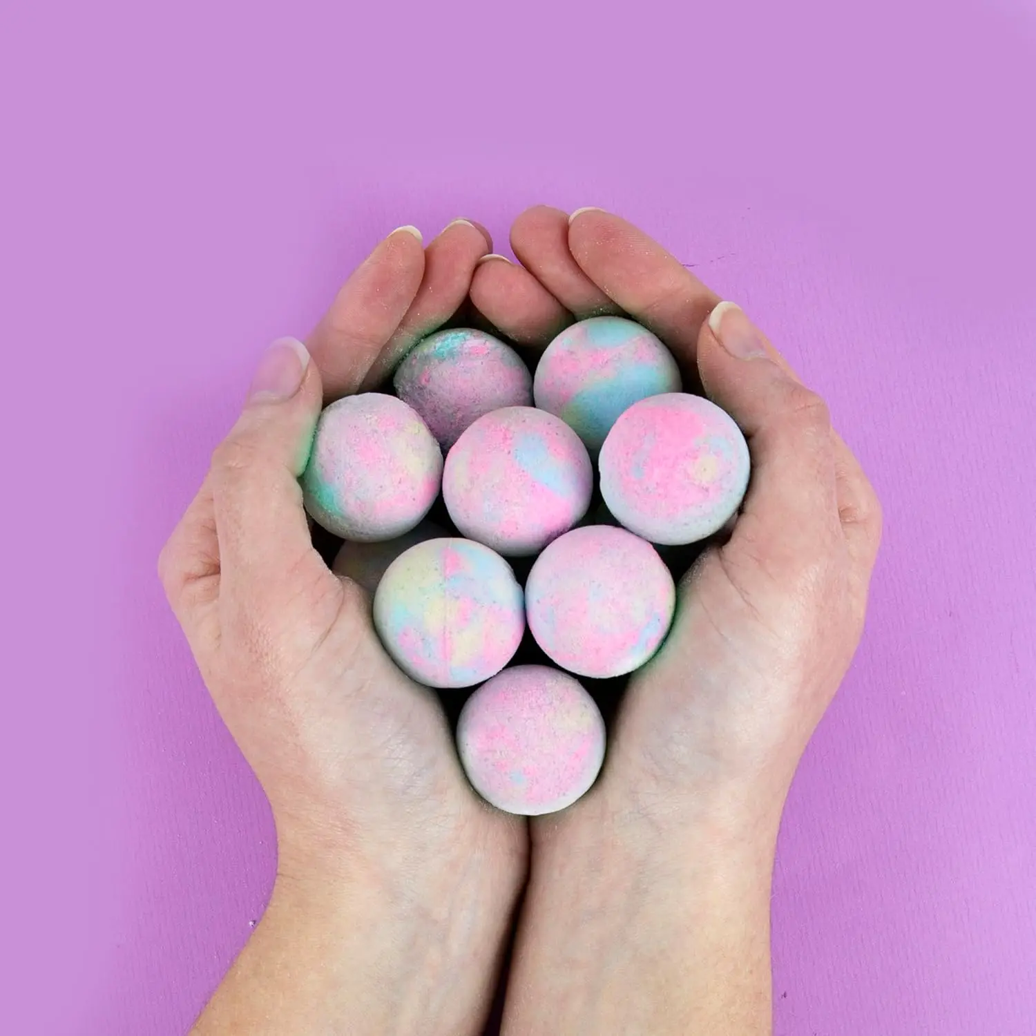 Ten raspberry-scented bath bombs create a magical unicorn-colored fizz in your bath.
