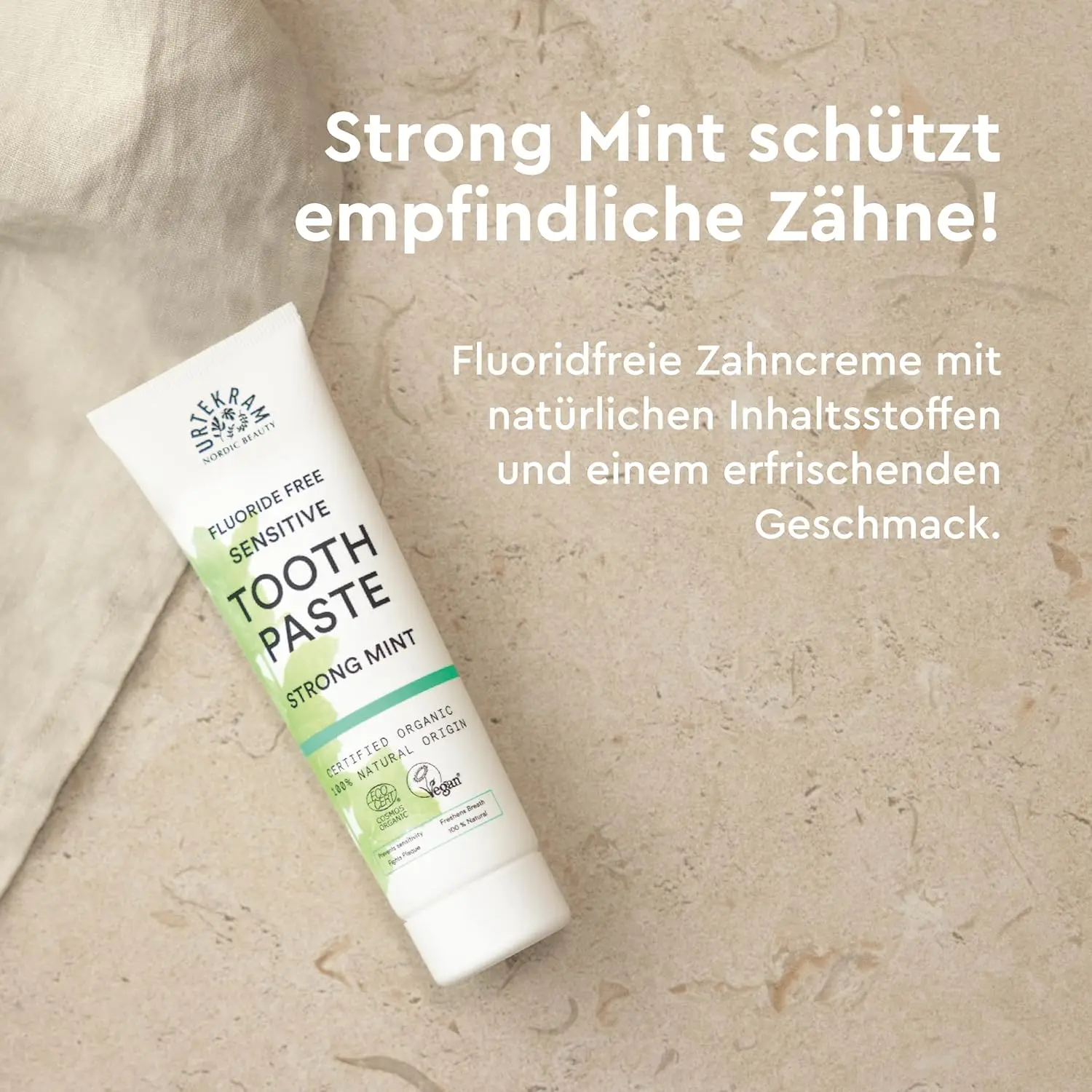 Tube of Urtekram Bio9 Strong Mint sensitive toothpaste with probiotic willow bark extract, offering natural defense, caries and plaque control, and gentle oral care.