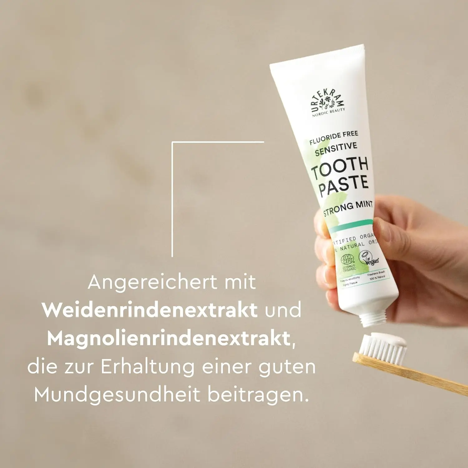 Tube of Urtekram Bio9 Strong Mint sensitive toothpaste with probiotic willow bark extract, offering natural defense, caries and plaque control, and gentle oral care.