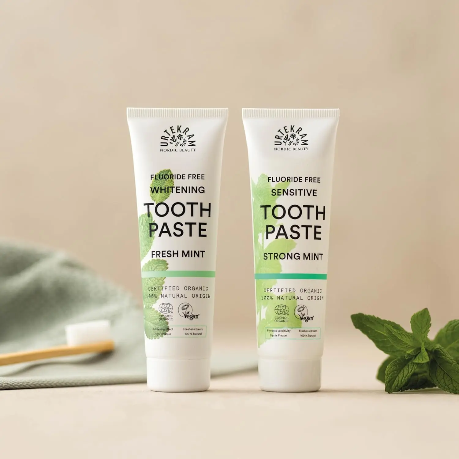 Tube of Urtekram Bio9 Strong Mint sensitive toothpaste with probiotic willow bark extract, offering natural defense, caries and plaque control, and gentle oral care.