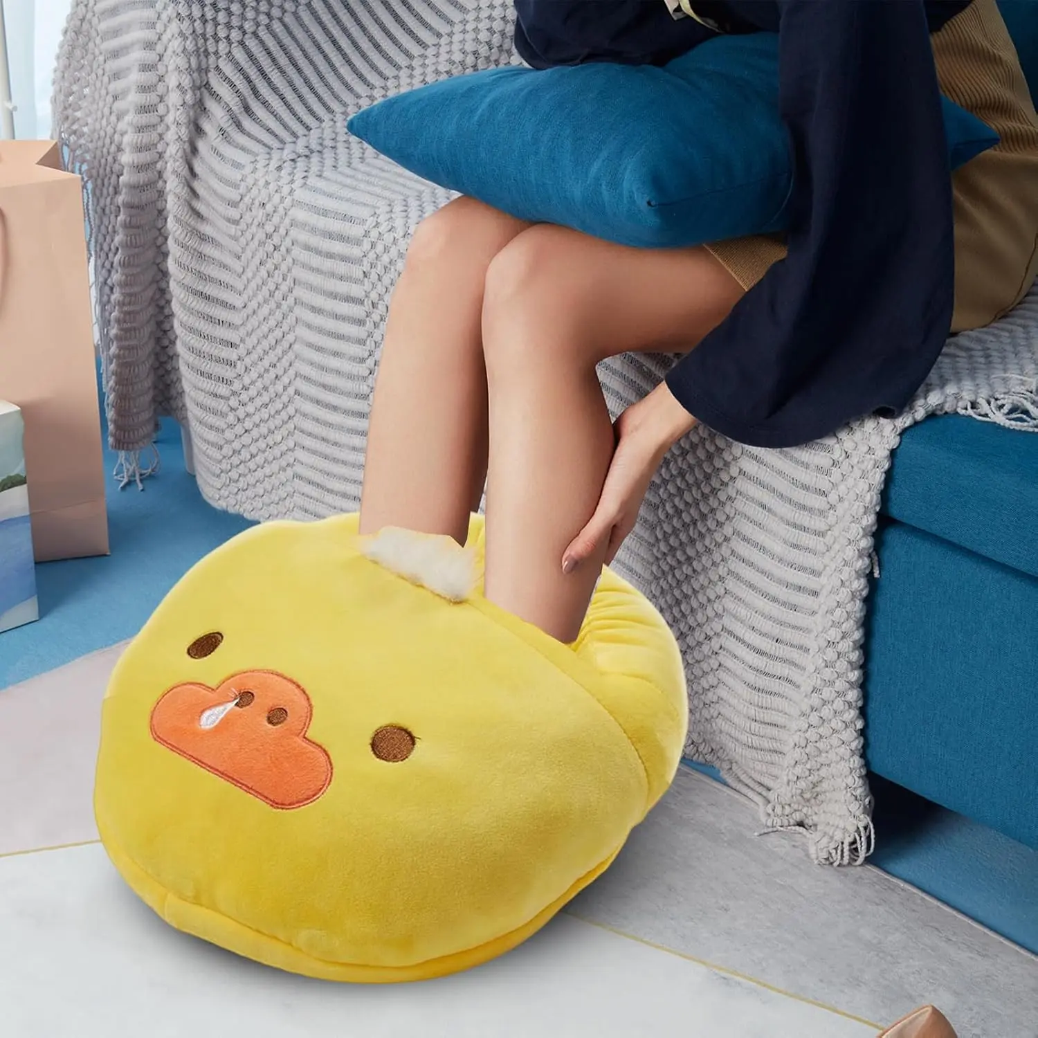 This USB foot warmer provides consistent, safe, and energy-efficient heat for under desk use at home or in the office, featuring overheat protection and a washable liner for comfortable, all-day foot warmth.