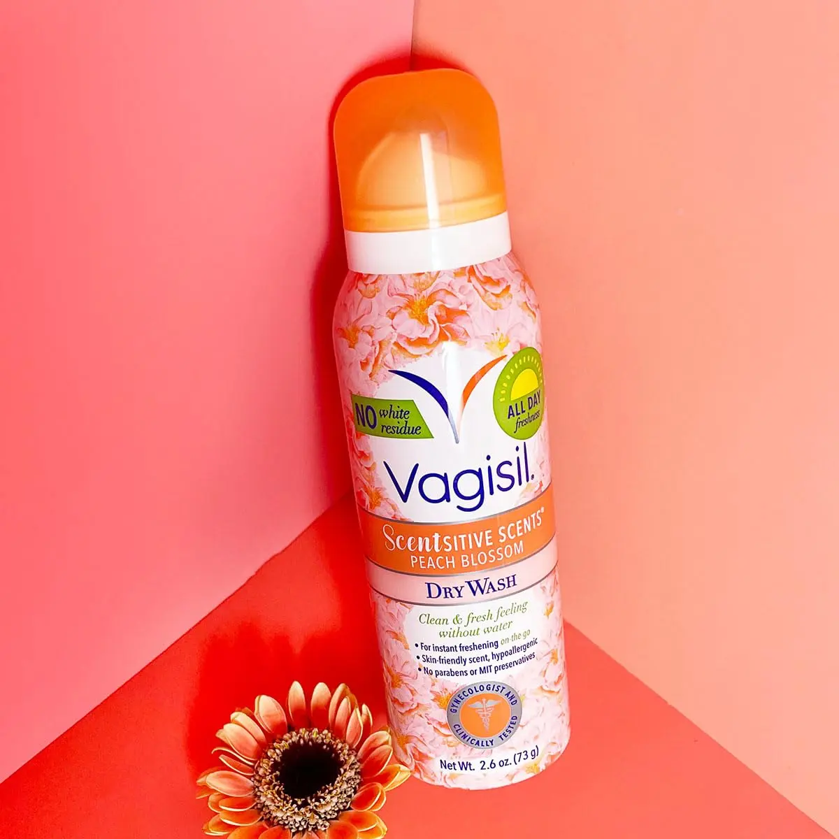 Four cans of Vagisil Peach Blossom Scentsitive Scents feminine dry wash spray provide a light, fruity, and convenient way to cleanse intimate skin without water, perfect for on-the-go freshness.