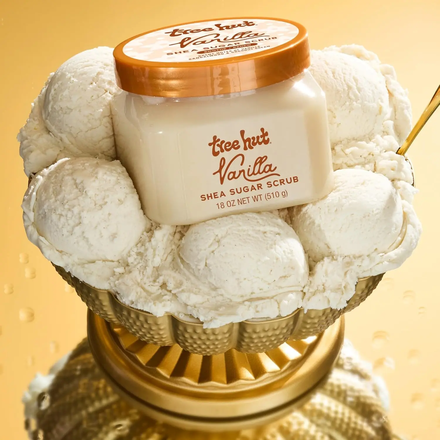 An 18 oz jar of Tree Hut Vanilla Shea Sugar Scrub exfoliates and hydrates skin, leaving it glowing, soft, and smooth with a warm vanilla scent.