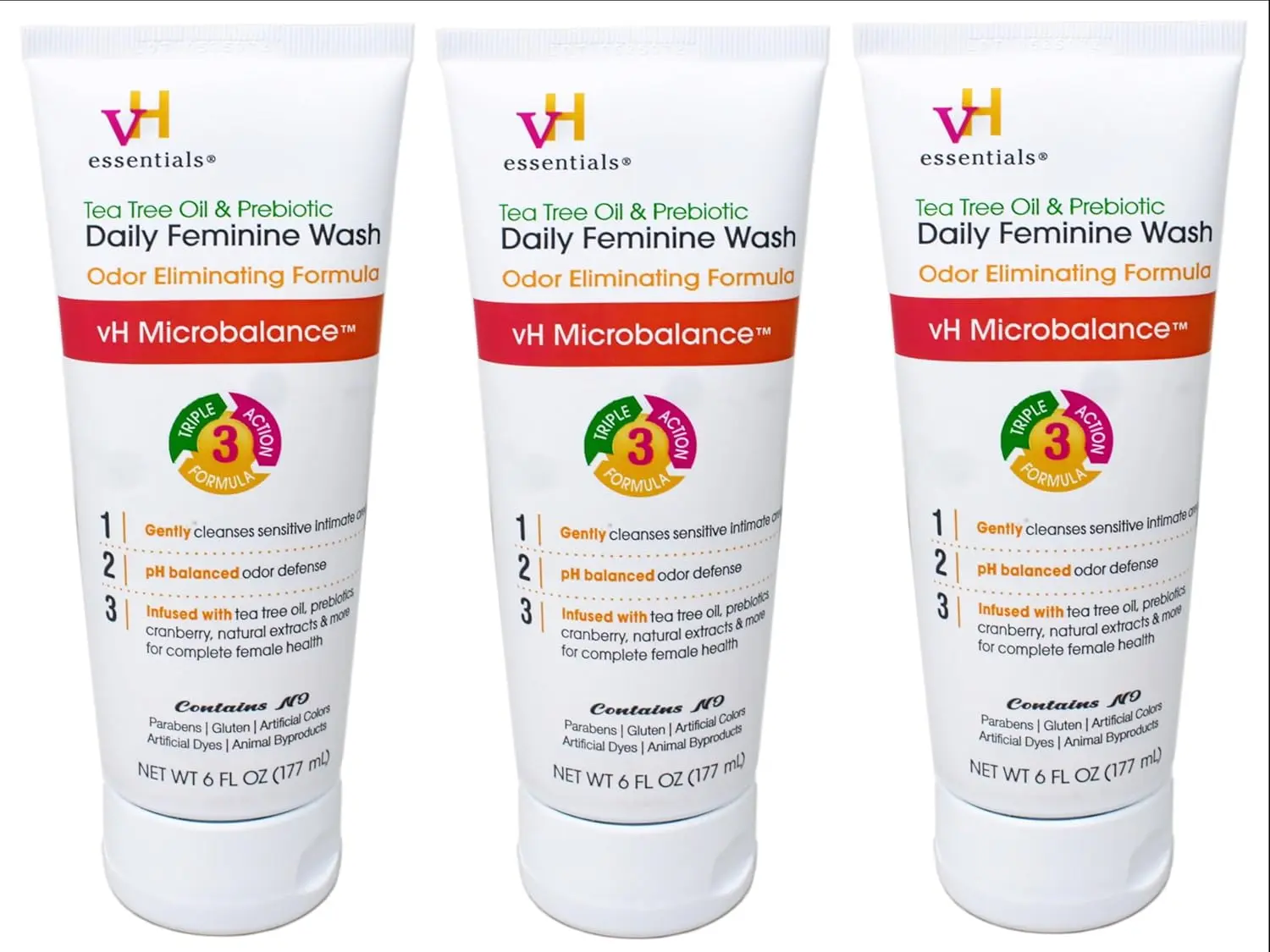 Three bottles of vH essentials Tea Tree Oil Intimate Feminine Wash with prebiotics, cranberry, and lavender, offering gentle and pH-balanced daily cleansing.