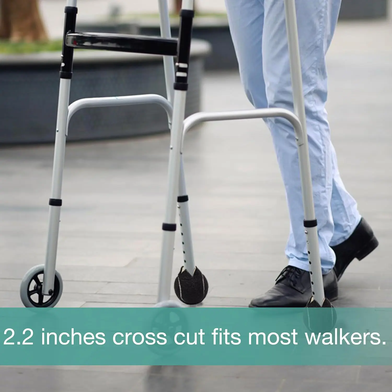 Two precut black tennis balls designed to protect hardwood floors and furniture legs like chairs, desks, tables, and walkers from scratches.