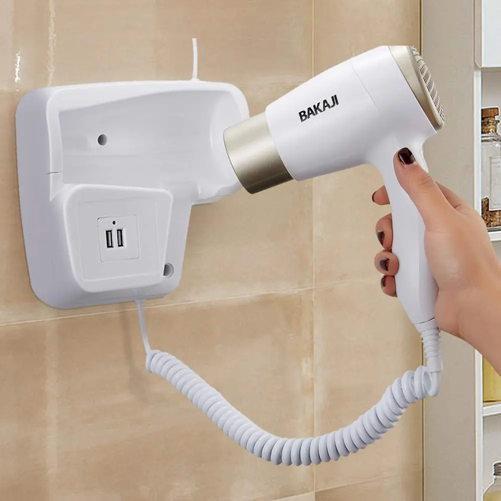White and platinum Bakaji wall mounted hair dryer with USB ports for charging smartphones in a bathroom or hotel setting.