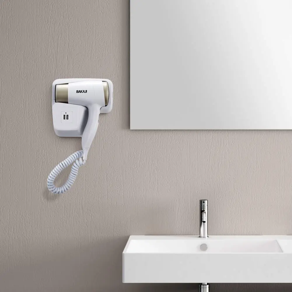 White and platinum Bakaji wall mounted hair dryer with USB ports for charging smartphones in a bathroom or hotel setting.