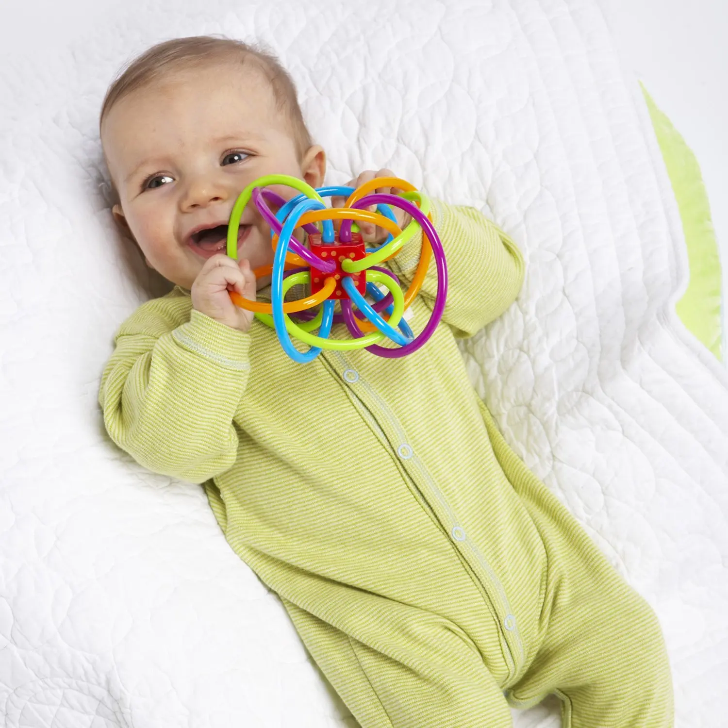 The Winkel rattle and sensory teether toy features colorful, soft tubes perfect for soothing teething babies and developing motor skills.
