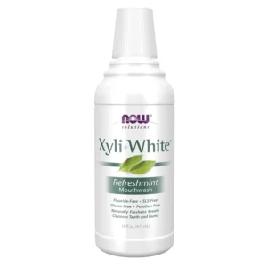 A bottle of NOW Xyliwhite Refreshmint mouthwash, a gluten and SLS-free dental care product that naturally freshens breath and cleanses teeth and gums with essential oils like peppermint and tea tree.