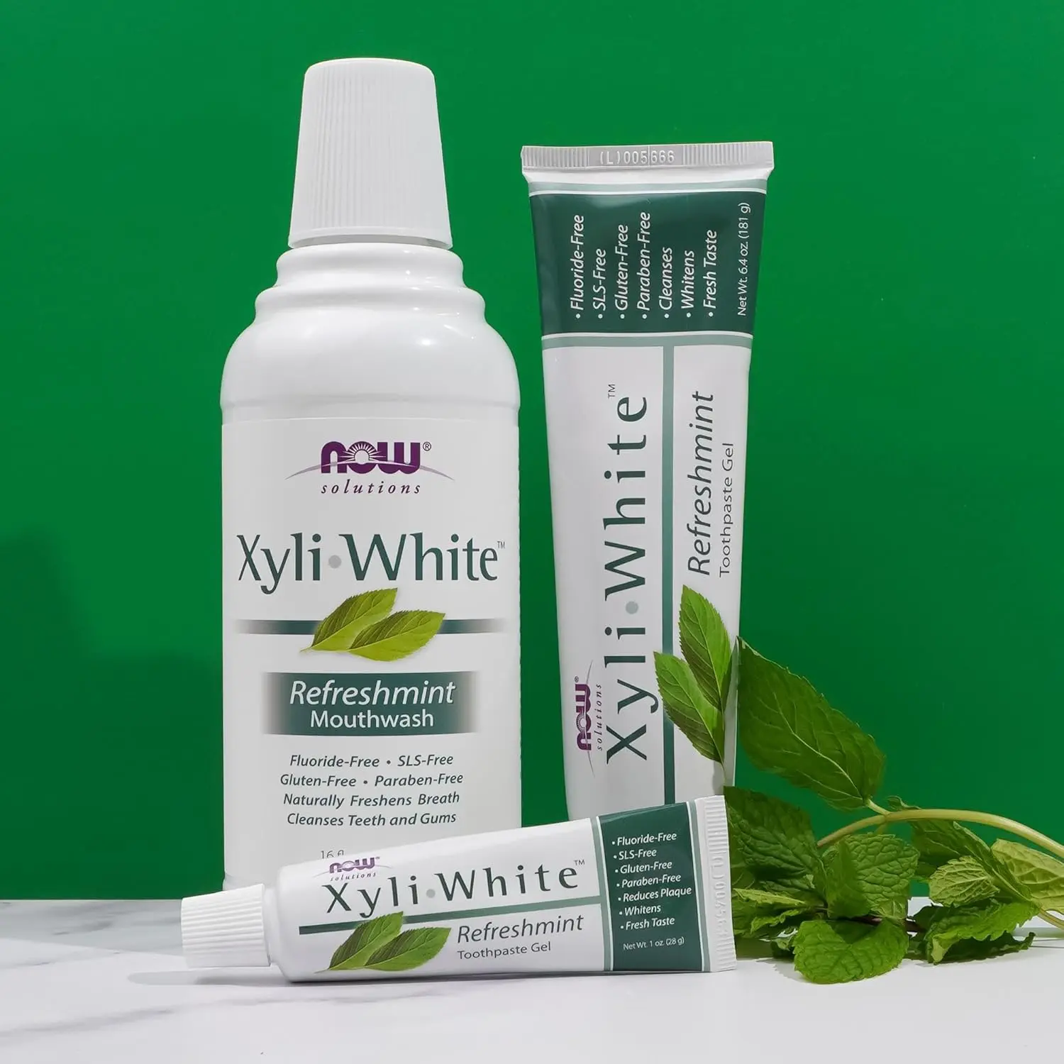 A bottle of NOW Xyliwhite Refreshmint mouthwash, a gluten and SLS-free dental care product that naturally freshens breath and cleanses teeth and gums with essential oils like peppermint and tea tree.