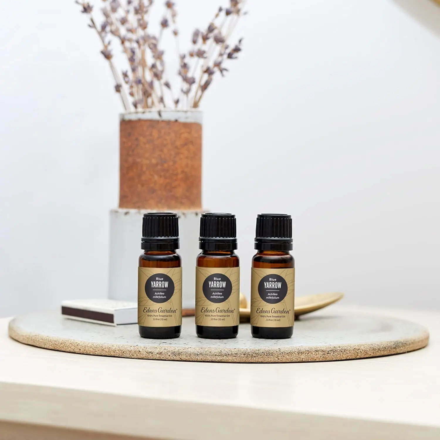 Bottle of Edens Garden Yarrow Essential Oil, a pure and therapeutic grade aromatherapy oil known for its woody, musky, and relaxing aroma.