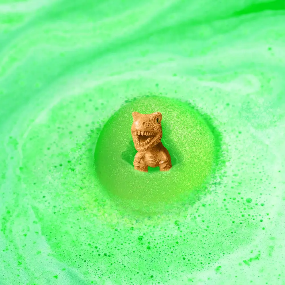 Six colorful Zimpli Kids bath bombs with surprise dinosaur toys inside, perfect as a fun and safe children's bath toy and birthday gift, made in the UK.